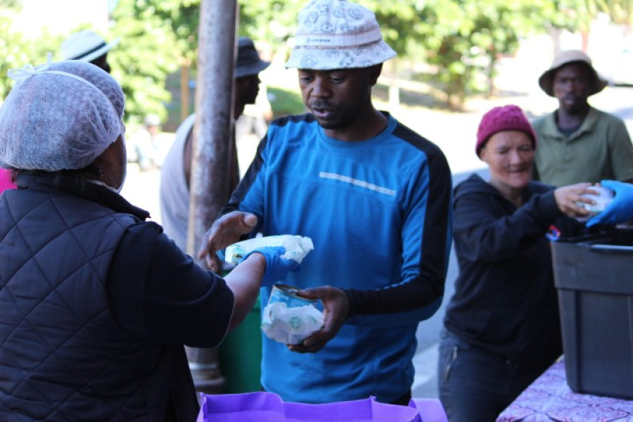 CCID Social Development field worker Shanien Stemmet assists at Service Dining Rooms which is serving meals to the homeless.